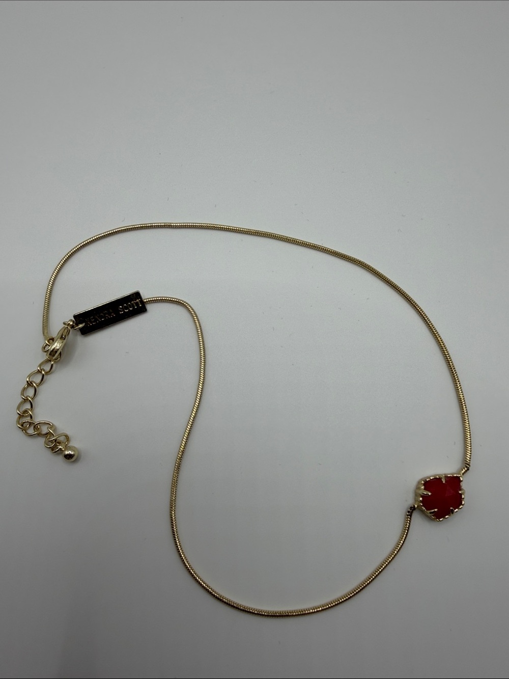Kendra Scott Gold Necklace with Red Quatrefoil Pendant